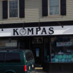 Kompas storefront sign