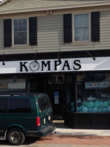 Kompas storefront sign